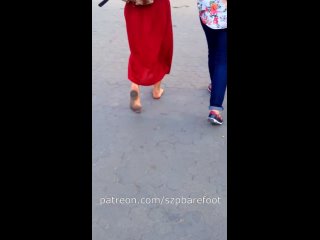 girl walking barefoot in the city